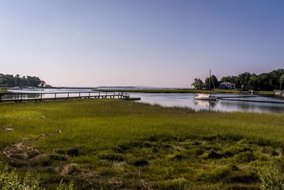 Scenic view of bridge over river against clear sky