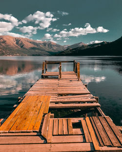 Pier over lake against sky