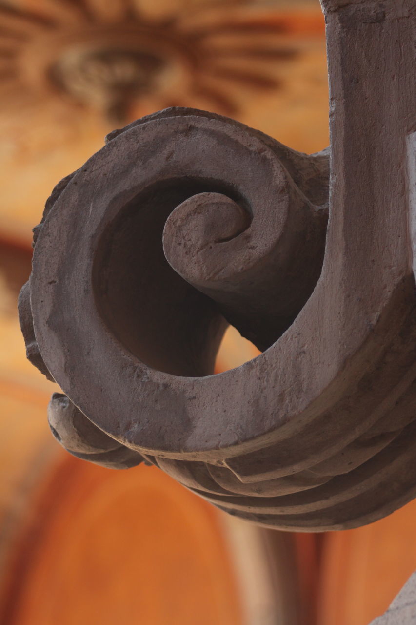 CLOSE-UP OF SCULPTURE IN METAL