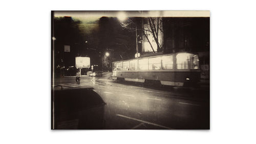 Cars on road against sky seen through windshield