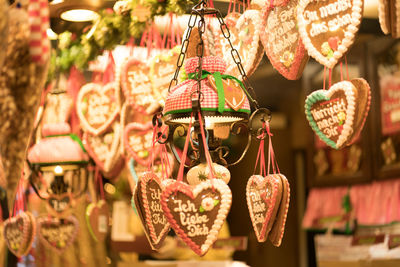 Festively decorated showcases of stalls at christmas market all kinds of gifts sweets crafts garland