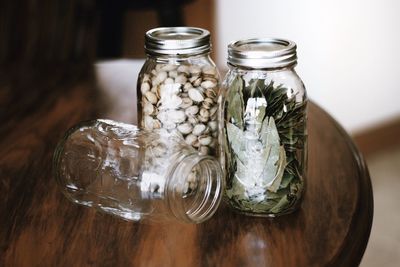 Close-up of food in jars on wooden table