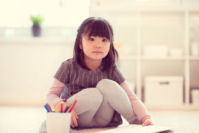 Portrait of a girl sitting at home