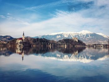 Scenic view of lake and mountains against sky