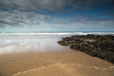 Scenic view of beach against sky
