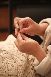 Cropped hand of woman holding hands