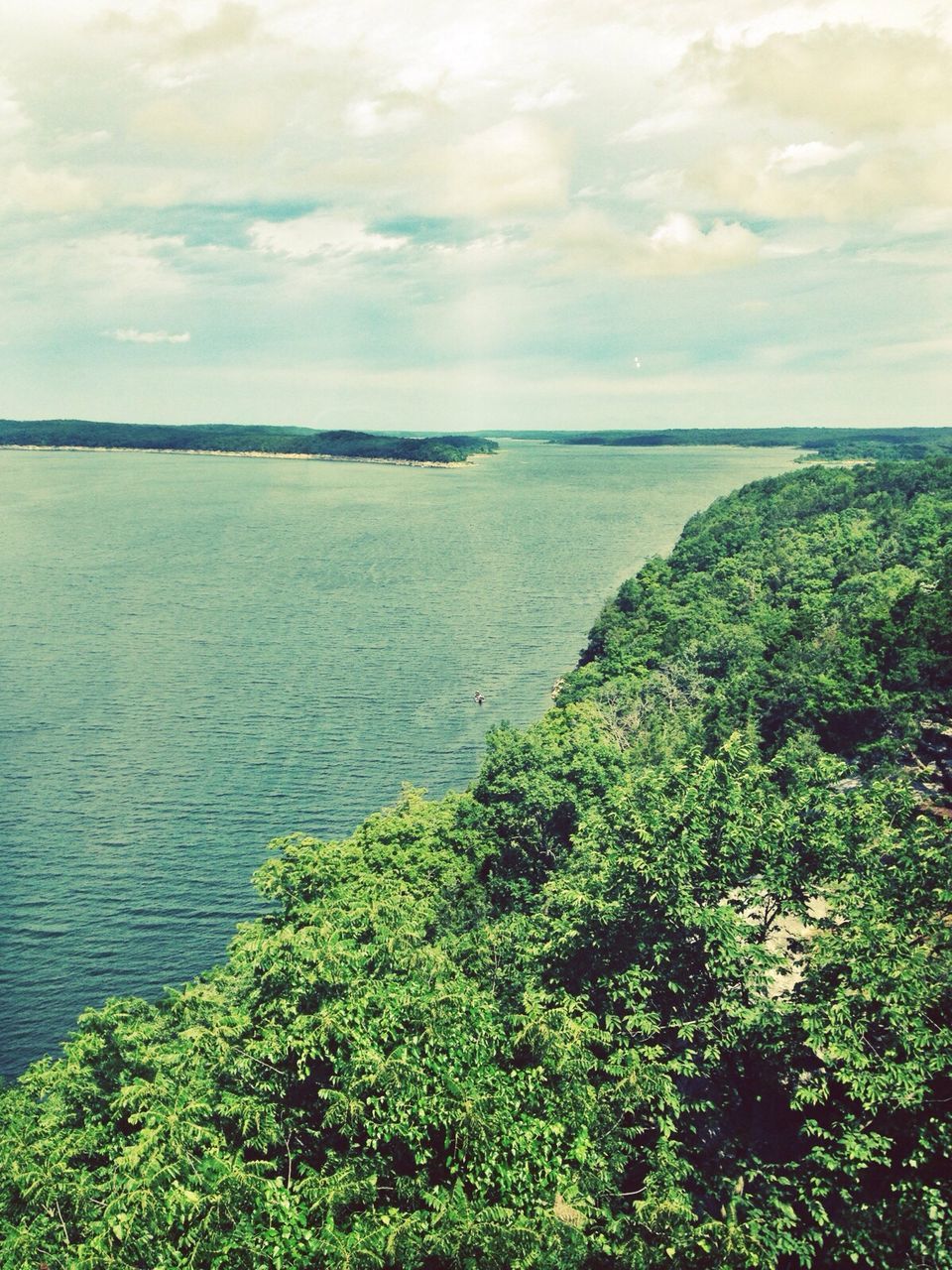 sea, sky, water, tranquil scene, tranquility, scenics, horizon over water, beauty in nature, cloud - sky, nature, cloudy, green color, cloud, idyllic, tree, plant, growth, high angle view, day, outdoors