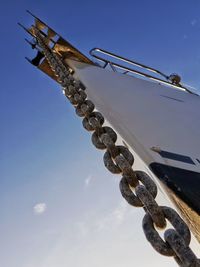 Low angle view of crane against sky