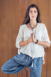 Portrait of young woman doing yoga 