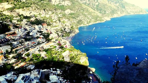 High angle view of sea and buildings in city