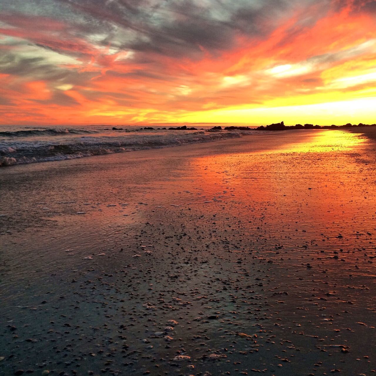 sunset, tranquil scene, sky, scenics, tranquility, orange color, beauty in nature, beach, water, cloud - sky, sea, idyllic, nature, shore, sand, dramatic sky, weather, cloudy, horizon over water, cloud