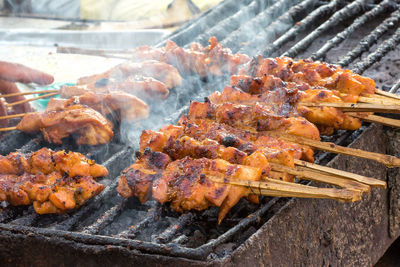 Close-up of meat on barbecue grill