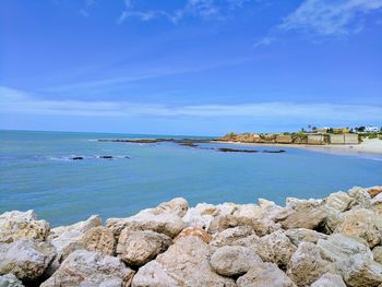 Scenic view of sea against blue sky