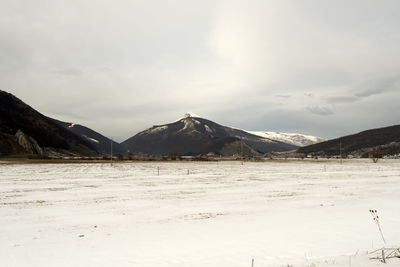 Scenic view of snowcapped mountains against sky