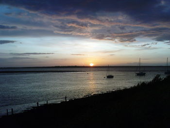 Scenic view of sea at sunset