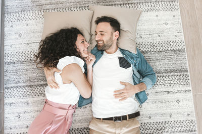 Young couple kissing on the floor