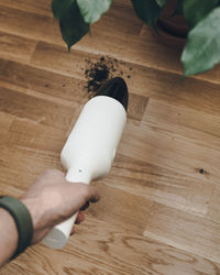 High angle view of person hand on table