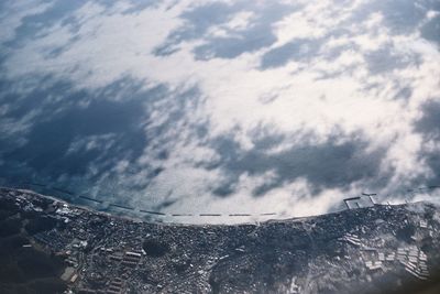 Low angle view of building against cloudy sky