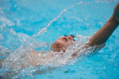 Man swimming in pool