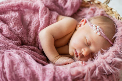 Cute baby sleeping in crib at home