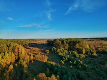 Scenic view of landscape against blue sky