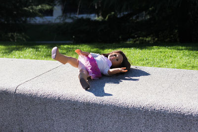 Full length of doll lying on grass