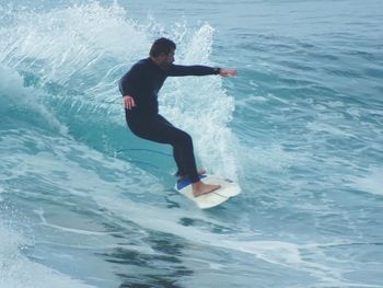 Full length of young man in sea