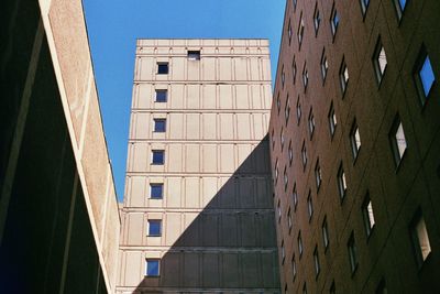 Low angle view of abandoned building against clear sky