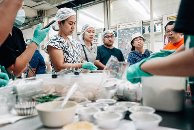 Group of people working in kitchen