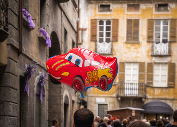  ballon car against multi colored building