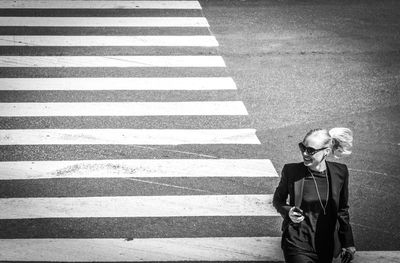 High angle view of man crossing road