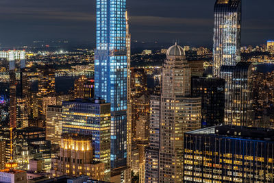 Illuminated buildings in city at night