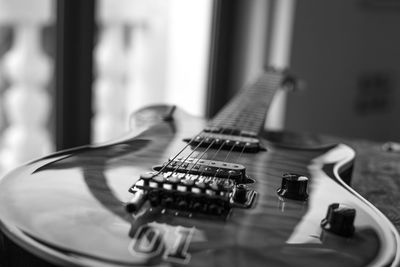 Close-up of guitar on table 