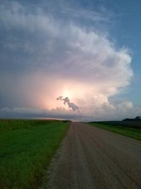 Scenic view of field against sky during sunset