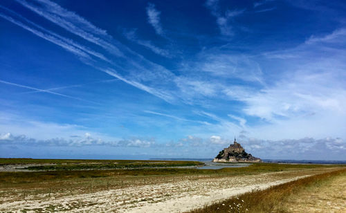 View of beach against blue sky