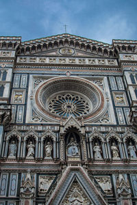 Low angle view of ornate building against sky