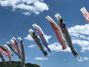 Low angle view of fish flags