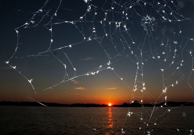 Scenic view of sea against sky at night