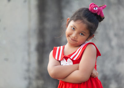 Portrait of cute girl standing outdoors