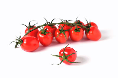 Close-up of cherry tomatoes against white background