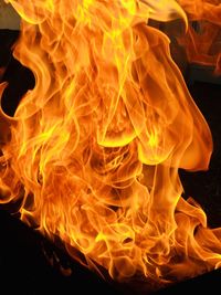 Close-up of fire burning at night