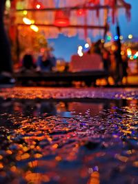 Surface level of wet street at night