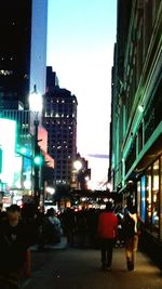 People walking on street in city