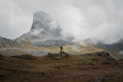 Man surfing on mountain against sky