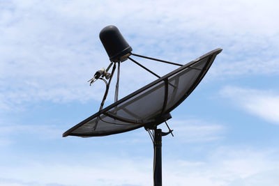 Low angle view of street light against sky