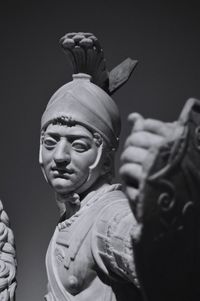 Close-up of sculpture against gray background
