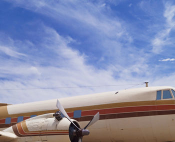 Low angle view of airplane against sky