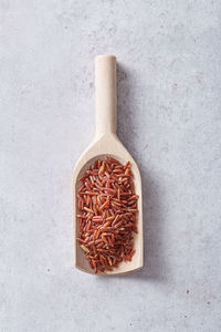 Directly above shot of bread in container against white background