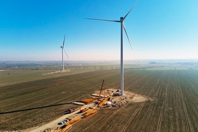 Construction site near windmill turbine, wind generator installing