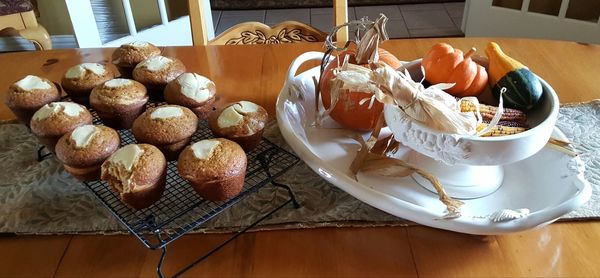 High angle view of cupcakes and vegetables on table